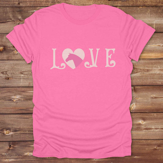 This Love Horses T-Shirt is the perfect expression of passion for horse lovers and cowgirls alike. With a unique heart-and-horse silhouette design and rustic western typography, it makes a thoughtful gift for birthdays, rodeo lovers, equestrians, and country women who live the cowboy lifestyle. The tee pairs well with denim, boots, and a bold cowgirl spirit. Whether for barn days, trail rides, or everyday western fashion, this shirt belongs in your rodeo ready wardrobe.