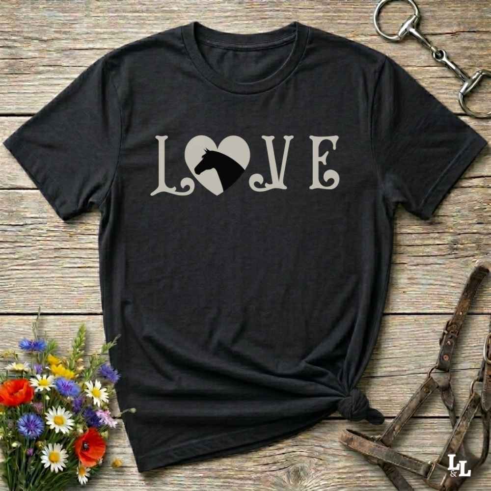 This Love Horses black T-Shirt is the perfect expression of passion for horse lovers and cowgirls alike. With a unique heart-and-horse silhouette design and rustic western typography, it makes a thoughtful gift for birthdays, rodeo lovers, equestrians, and country women who live the cowboy lifestyle. The tee pairs well with denim, boots, and a bold cowgirl spirit. Whether for barn days, trail rides, or everyday western fashion, this shirt belongs in your rodeo ready wardrobe.