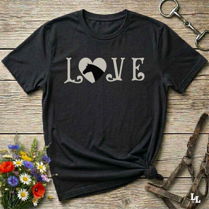This Love Horses black T-Shirt is the perfect expression of passion for horse lovers and cowgirls alike. With a unique heart-and-horse silhouette design and rustic western typography, it makes a thoughtful gift for birthdays, rodeo lovers, equestrians, and country women who live the cowboy lifestyle. The tee pairs well with denim, boots, and a bold cowgirl spirit. Whether for barn days, trail rides, or everyday western fashion, this shirt belongs in your rodeo ready wardrobe.