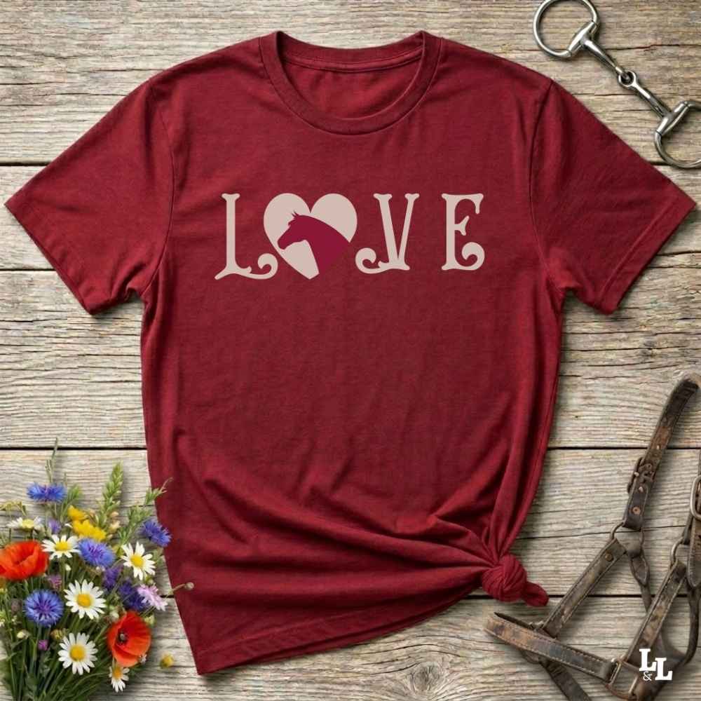 This Love Horses red T-Shirt is the perfect expression of passion for horse lovers and cowgirls alike. With a unique heart-and-horse silhouette design and rustic western typography, it makes a thoughtful gift for birthdays, rodeo lovers, equestrians, and country women who live the cowboy lifestyle. The tee pairs well with denim, boots, and a bold cowgirl spirit. Whether for barn days, trail rides, or everyday western fashion, this shirt belongs in your rodeo ready wardrobe.