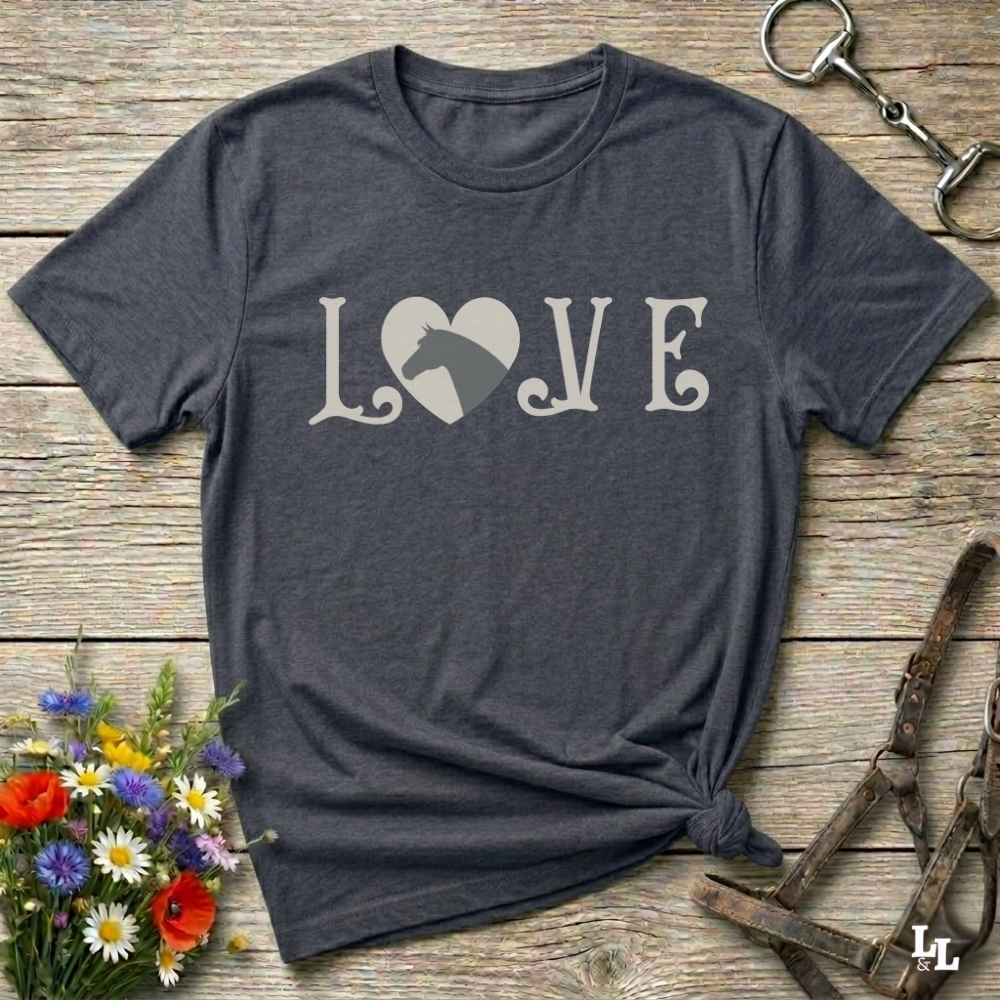 This Love Horses gray T-Shirt is the perfect expression of passion for horse lovers and cowgirls alike. With a unique heart-and-horse silhouette design and rustic western typography, it makes a thoughtful gift for birthdays, rodeo lovers, equestrians, and country women who live the cowboy lifestyle. The tee pairs well with denim, boots, and a bold cowgirl spirit. Whether for barn days, trail rides, or everyday western fashion, this shirt belongs in your rodeo ready wardrobe.
