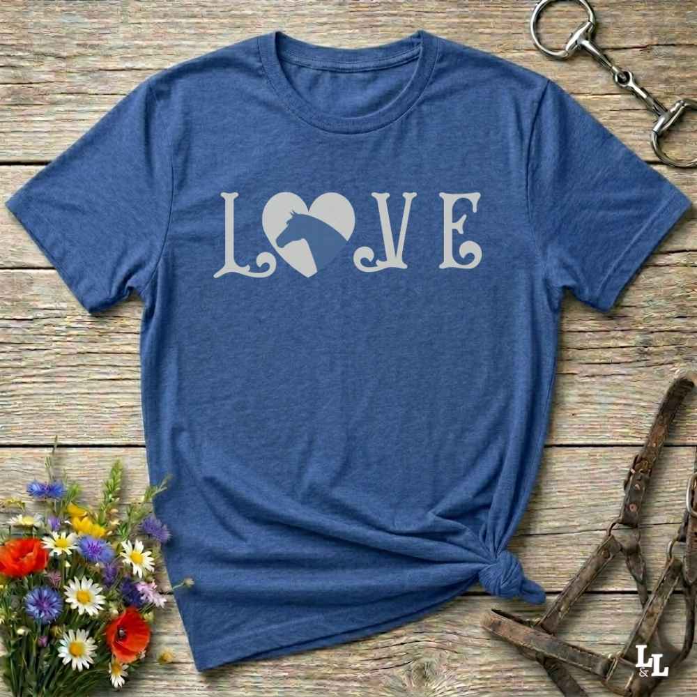 This Love Horses blue T-Shirt is the perfect expression of passion for horse lovers and cowgirls alike. With a unique heart-and-horse silhouette design and rustic western typography, it makes a thoughtful gift for birthdays, rodeo lovers, equestrians, and country women who live the cowboy lifestyle. The tee pairs well with denim, boots, and a bold cowgirl spirit. Whether for barn days, trail rides, or everyday western fashion, this shirt belongs in your rodeo ready wardrobe.