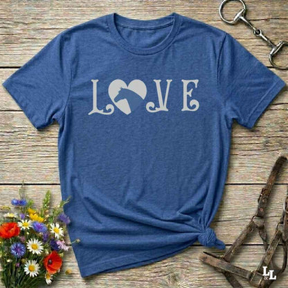 This Love Horses blue T-Shirt is the perfect expression of passion for horse lovers and cowgirls alike. With a unique heart-and-horse silhouette design and rustic western typography, it makes a thoughtful gift for birthdays, rodeo lovers, equestrians, and country women who live the cowboy lifestyle. The tee pairs well with denim, boots, and a bold cowgirl spirit. Whether for barn days, trail rides, or everyday western fashion, this shirt belongs in your rodeo ready wardrobe.
