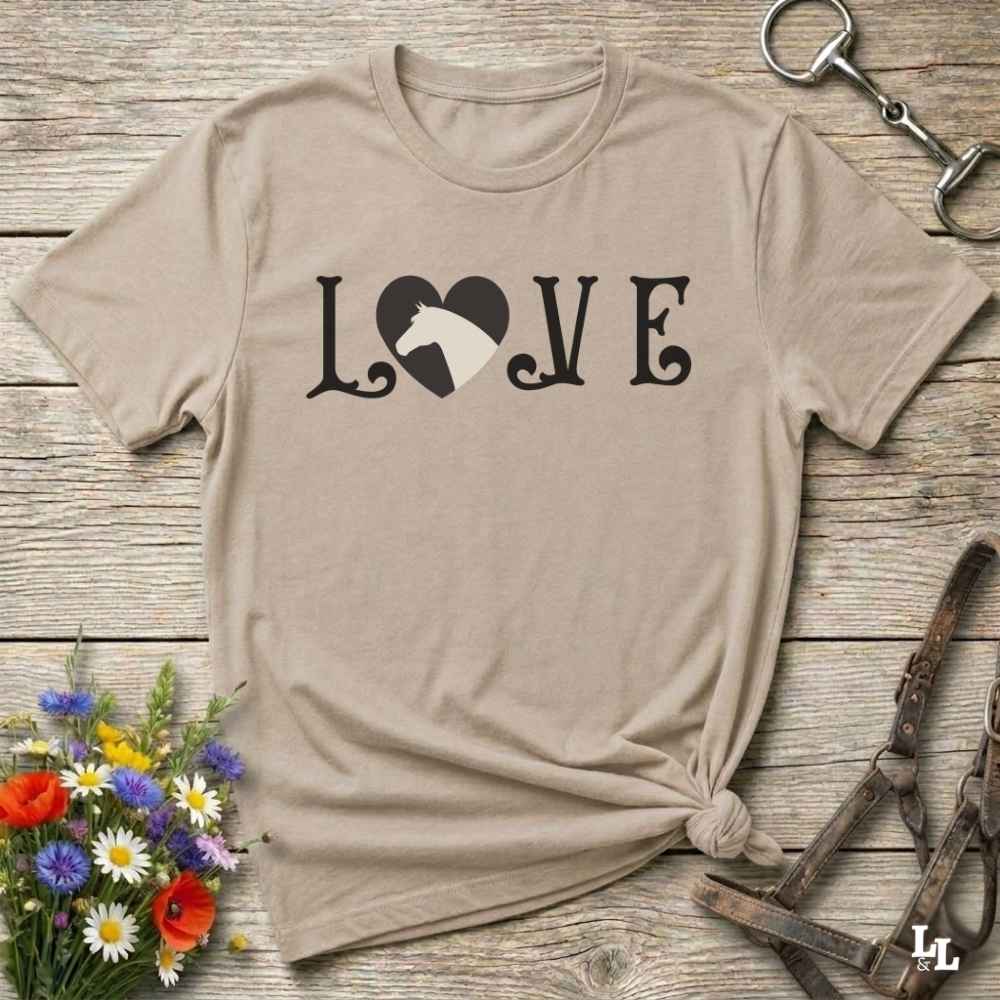 This Love Horses beige T-Shirt is the perfect expression of passion for horse lovers and cowgirls alike. With a unique heart-and-horse silhouette design and rustic western typography, it makes a thoughtful gift for birthdays, rodeo lovers, equestrians, and country women who live the cowboy lifestyle. The tee pairs well with denim, boots, and a bold cowgirl spirit. Whether for barn days, trail rides, or everyday western fashion, this shirt belongs in your rodeo ready wardrobe.