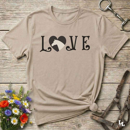This Love Horses beige T-Shirt is the perfect expression of passion for horse lovers and cowgirls alike. With a unique heart-and-horse silhouette design and rustic western typography, it makes a thoughtful gift for birthdays, rodeo lovers, equestrians, and country women who live the cowboy lifestyle. The tee pairs well with denim, boots, and a bold cowgirl spirit. Whether for barn days, trail rides, or everyday western fashion, this shirt belongs in your rodeo ready wardrobe.