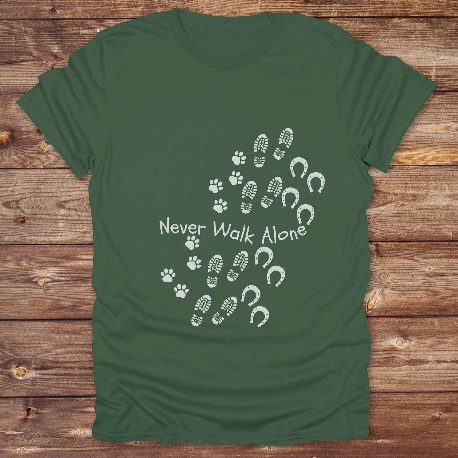 Celebrate the unbreakable bond between dogs, horses, and their human companions with this heartfelt "Never Walk Alone" western-style t-shirt. Featuring boot, paw, and hoof prints in a soft rustic print, this tee is perfect for cowgirls, dog moms, horse lovers, and equestrian trail riders alike. Whether you're walking through a ranch, riding across fields, or heading to the stables, this shirt is a perfect fit for your country lifestyle. Makes a thoughtful gift for birthdays, pet memorials, and western pet l