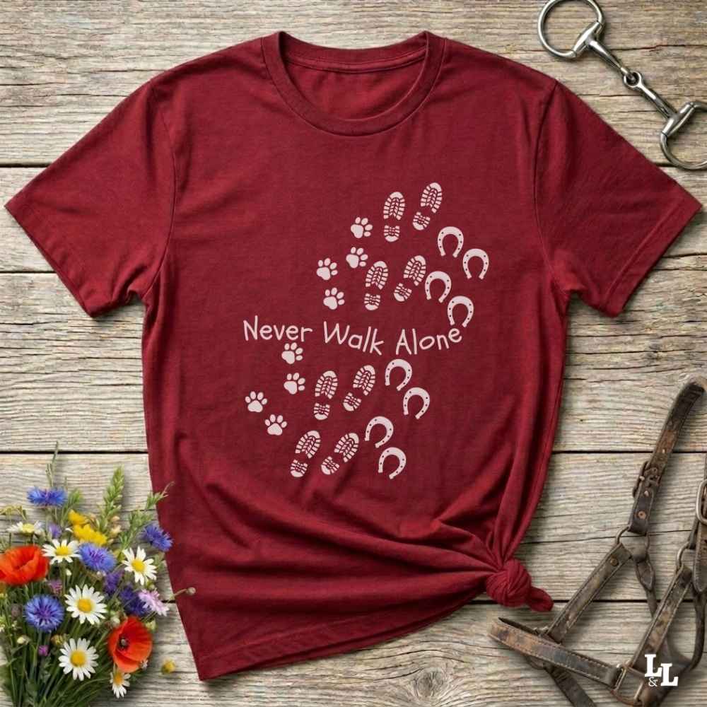 red Cozy unisex horse lover t-shirt featuring a pair of horses and the phrase ‘Never Walk Alone’”