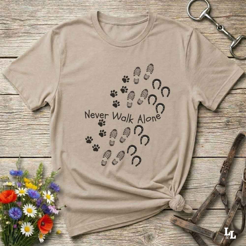 beige Cozy unisex horse lover t-shirt featuring a pair of horses and the phrase ‘Never Walk Alone’”