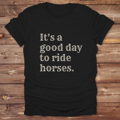 “It’s a Good Day to Ride Horses” t-shirt. Designed for horse lovers, cowgirls, cowboys, and rodeo fans, this rustic tee is a perfect fit for barn life, trail rides, and daily adventures. C. Top selling graphic tee captures the heart of equestrian style and country freedom. Ideal as a birthday gift, casual statement piece, or rodeo outfit, this tee is a must have for saddle up days and western quotes that ride with meaning. Loved by riders, designed for style.