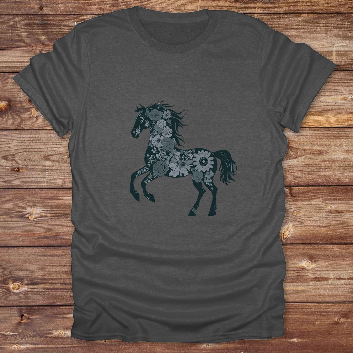 This Boho Flower Horse T-Shirt blends rustic western style with soft feminine charm, featuring a bold silhouette of a galloping mustang filled with intricate floral details. erfect for horse lovers, cowgirls, rodeo fans, and anyone who loves a touch of bohemian elegance in their western wardrobe. Made in 8 beautiful earthy tones, this graphic tee is ideal for birthdays, rodeo days, horse barn adventures, or simply showing off your equestrian spirit in everyday style.  