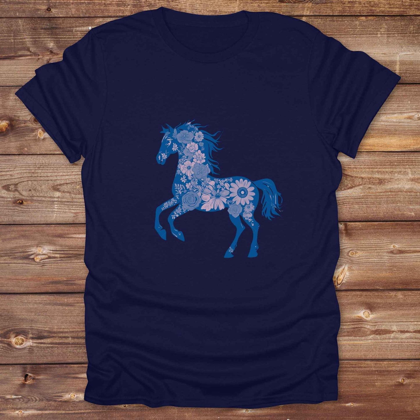 This Boho Flower Horse T-Shirt blends rustic western style with soft feminine charm, featuring a bold silhouette of a galloping mustang filled with intricate floral details. erfect for horse lovers, cowgirls, rodeo fans, and anyone who loves a touch of bohemian elegance in their western wardrobe. Made in 8 beautiful earthy tones, this graphic tee is ideal for birthdays, rodeo days, horse barn adventures, or simply showing off your equestrian spirit in everyday style.  