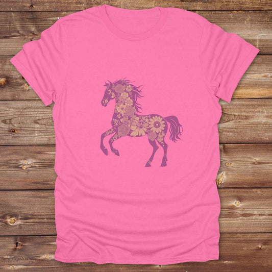 This Boho Flower Horse T-Shirt blends rustic western style with soft feminine charm, featuring a bold silhouette of a galloping mustang filled with intricate floral details. erfect for horse lovers, cowgirls, rodeo fans, and anyone who loves a touch of bohemian elegance in their western wardrobe. Made in 8 beautiful earthy tones, this graphic tee is ideal for birthdays, rodeo days, horse barn adventures, or simply showing off your equestrian spirit in everyday style.  