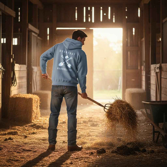 Man in a blue hoodie working with hay in a barn at sunset Everyday Shovelling Hoodie for Horse Lovers, Wester Style Wear, Mens Hoodies, Cowgirl Sweatshirts