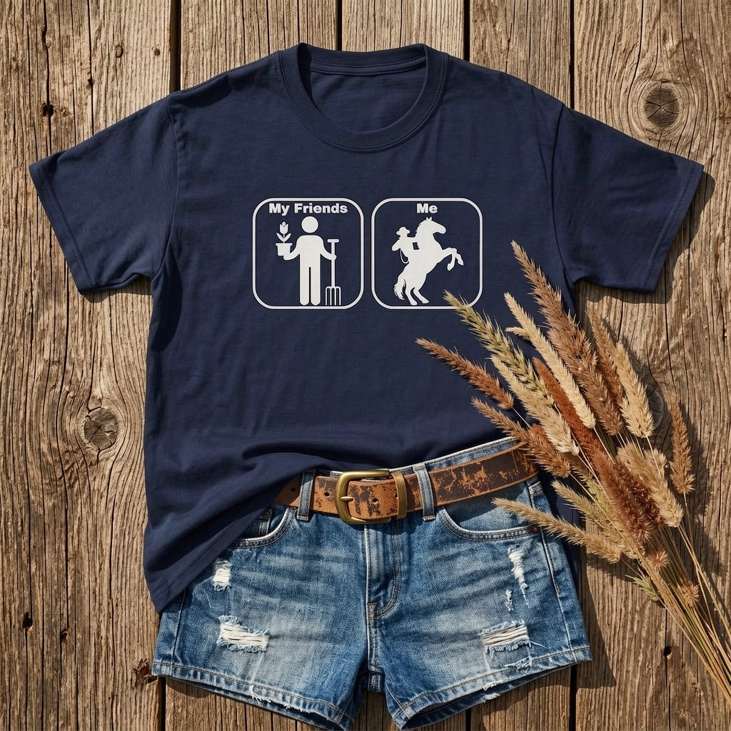 Navy blue t-shirt with graphic design on a wooden surface with denim shorts and dried grass. Age Appropriate T-Shirt Funny T-Shirt for Horse Lover, Western Tee Cowgirl Shirt.
